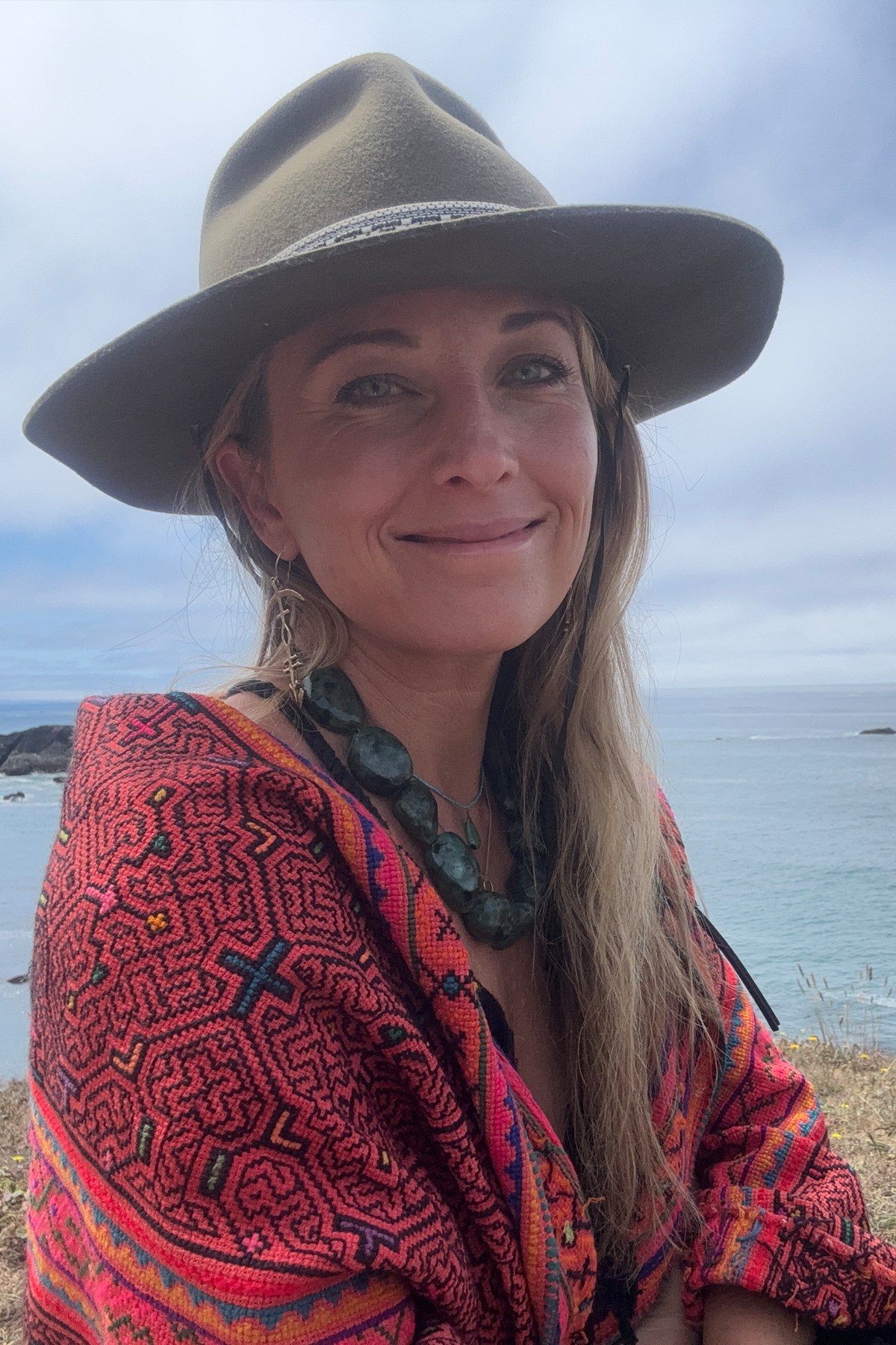Rachel Naomi on the Humboldt coast in hat and patterned shawl
